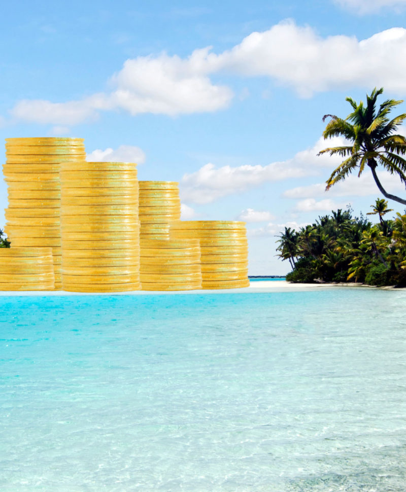 Offshore banking and  tax havens concept with golden coins on sand island and palm trees. Copy space